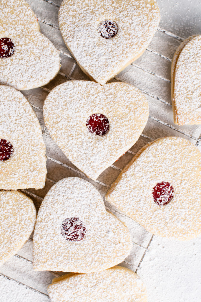 jam sandwich cookies heart shaped and dusted with powdered sugar
